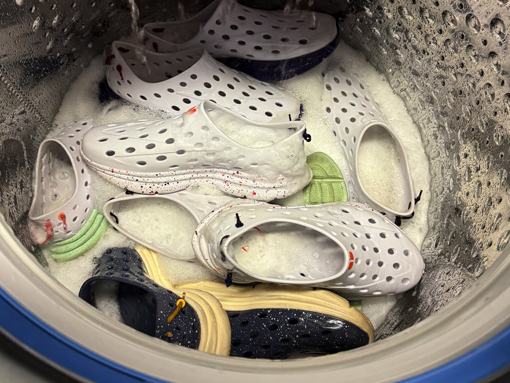 KANE shoes being washed in a washing machine with soapy water