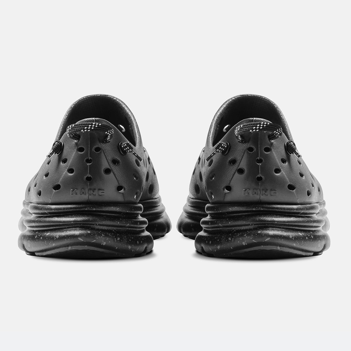 KANE Revive recovery shoe in charcoal / black speckle color, back view