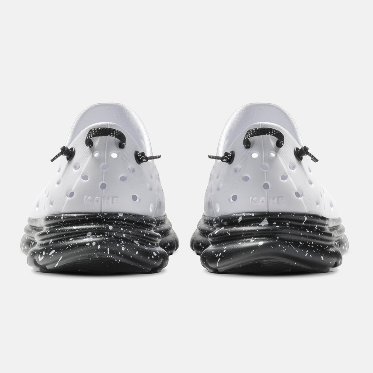 KANE Revive recovery shoe in white / black speckle color, back view