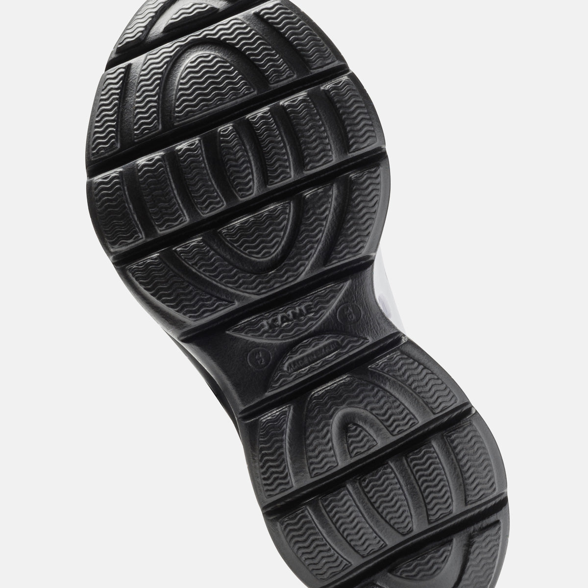 KANE Revive recovery shoe in white / black speckle color, bottom view