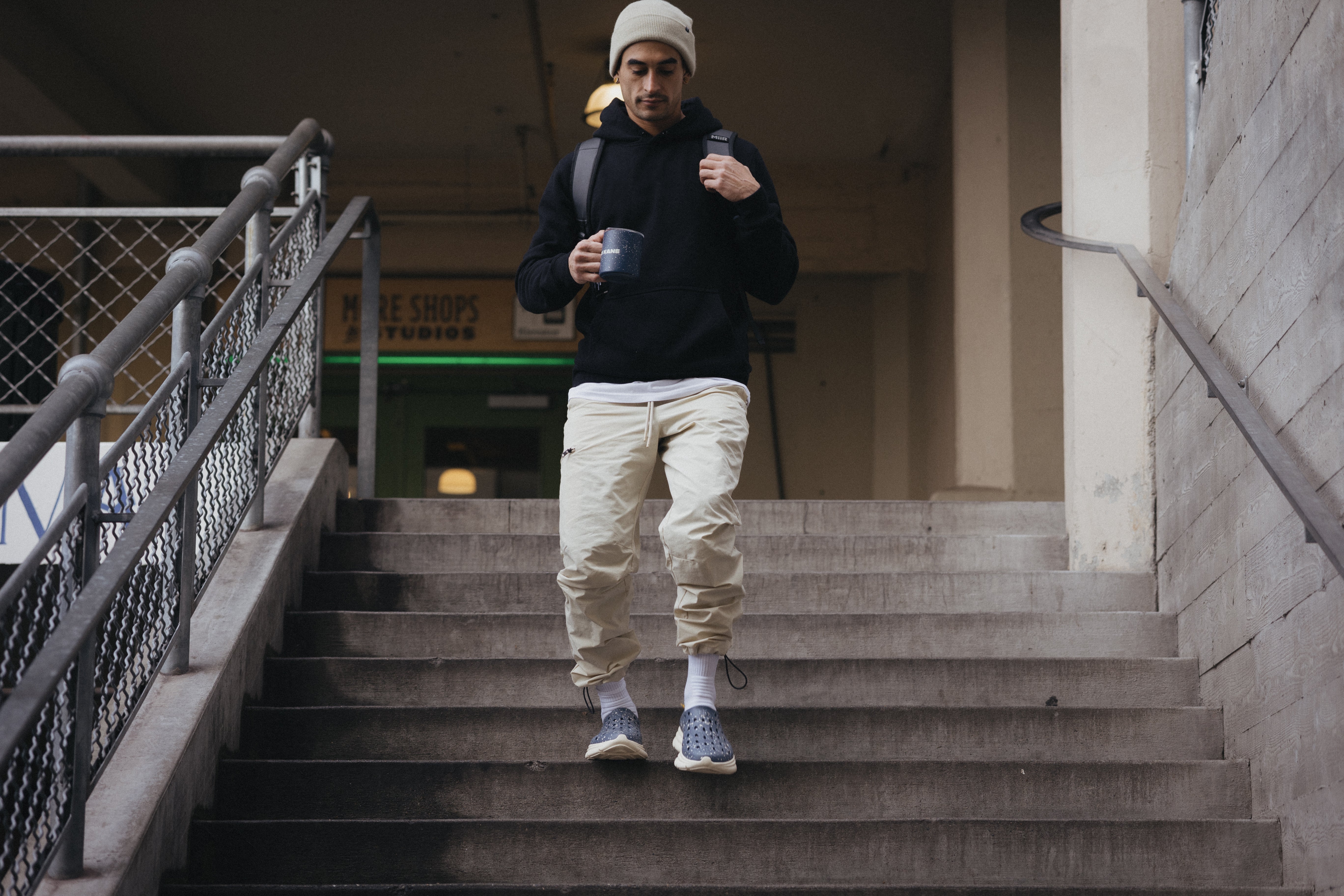 A man walking downstairs wearing Kane MiiR shoes. Perfect for comfortable lifestyle wear.