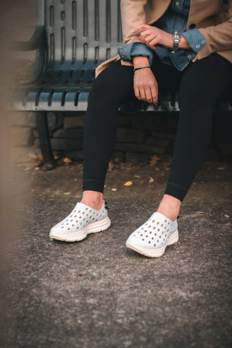 A maid taking a lunch break, with a close up shot of her white Kane Revive shoes