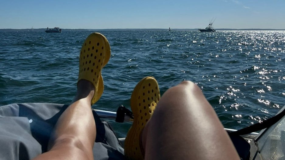 Kicking your feet up on a boat, wearing Kane Revive shoes. Relaxing and watching the boats go by.