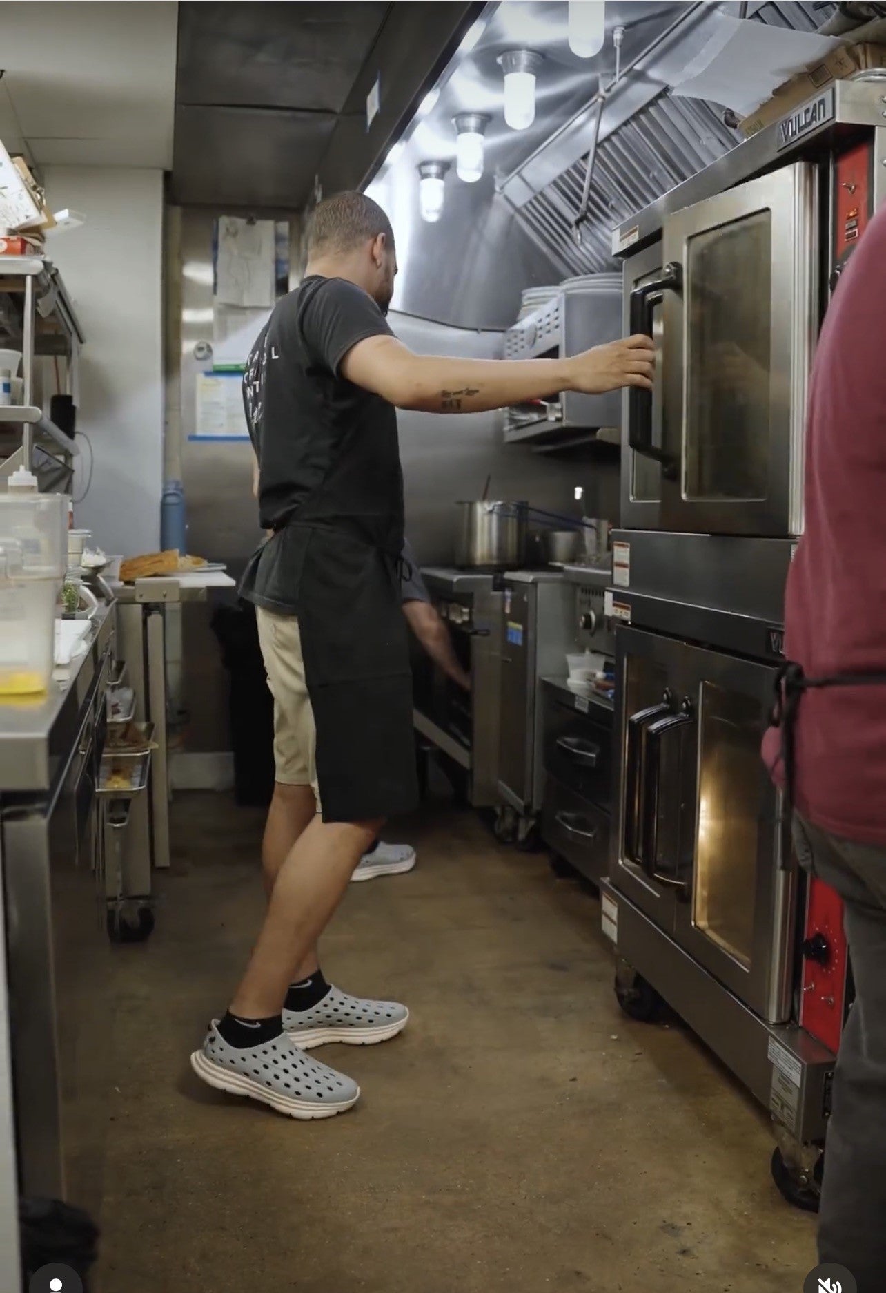 A cook working in the kitchen, wearing his comfortable and non-slip Kane Revive shoes.