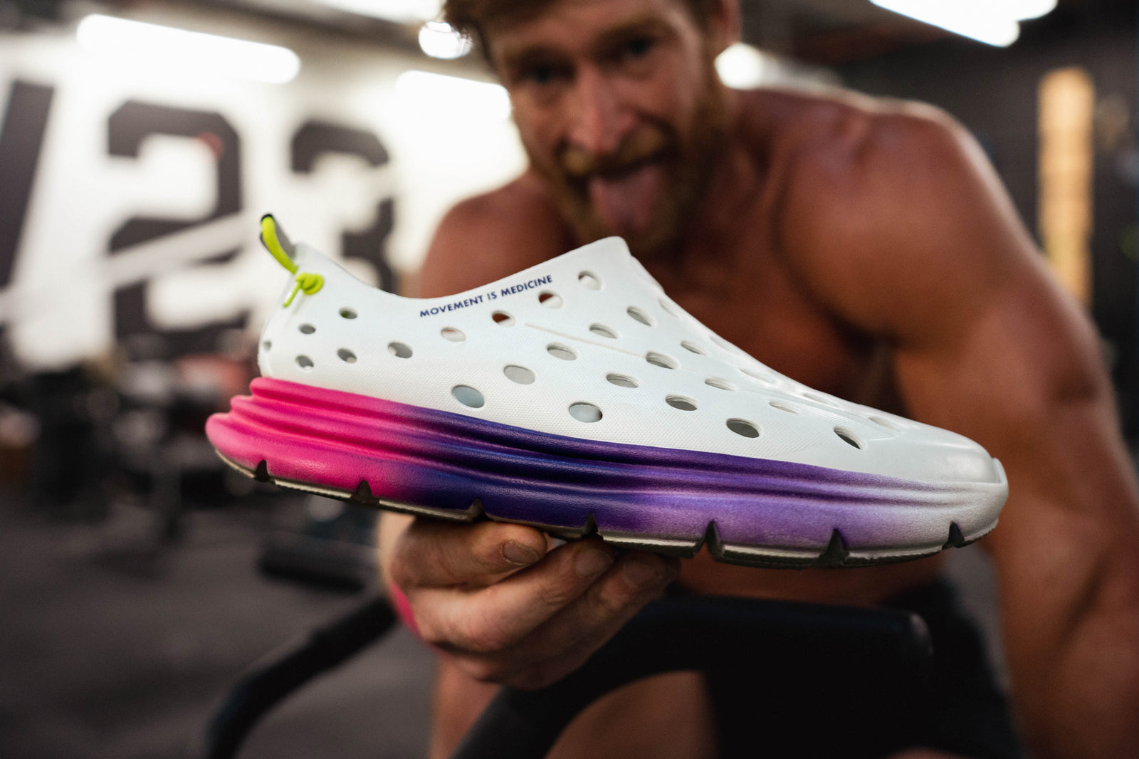 Close-up view of white Kane Revive shoes with a blurred backdrop, focusing on the stylish speckling of the shoe.